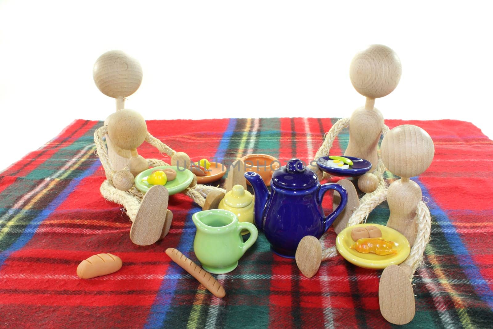 A small family on a blanket having a picnic