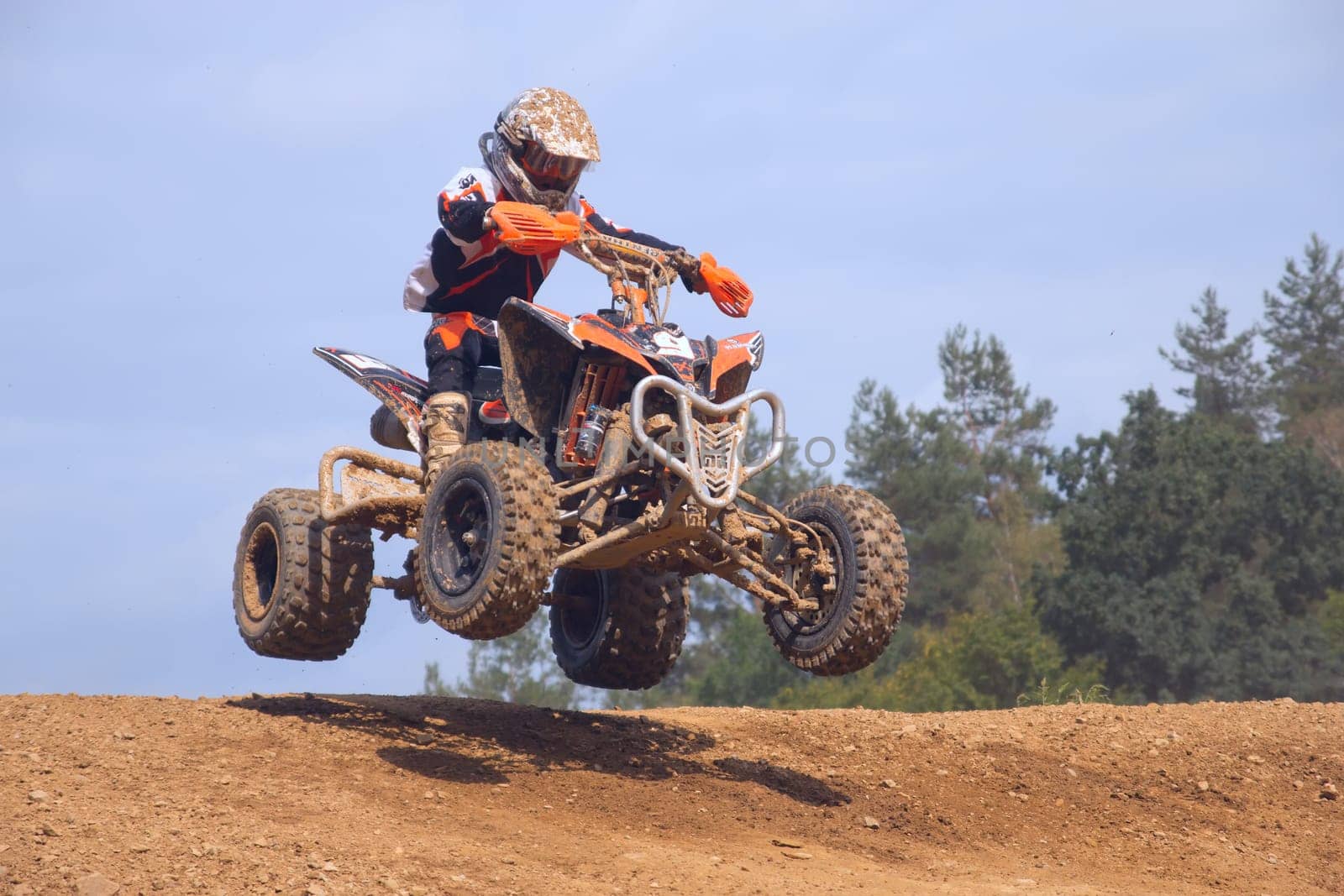 MOHELNICE,  CZECH REPUBLIC - SEPTEMBER 08: Unidentified teen racer jumps a quad motorbike in the "International Championship of the Czech Republic 2012"" on September 08, 2012 in MOHELNICE, Czech Republic."