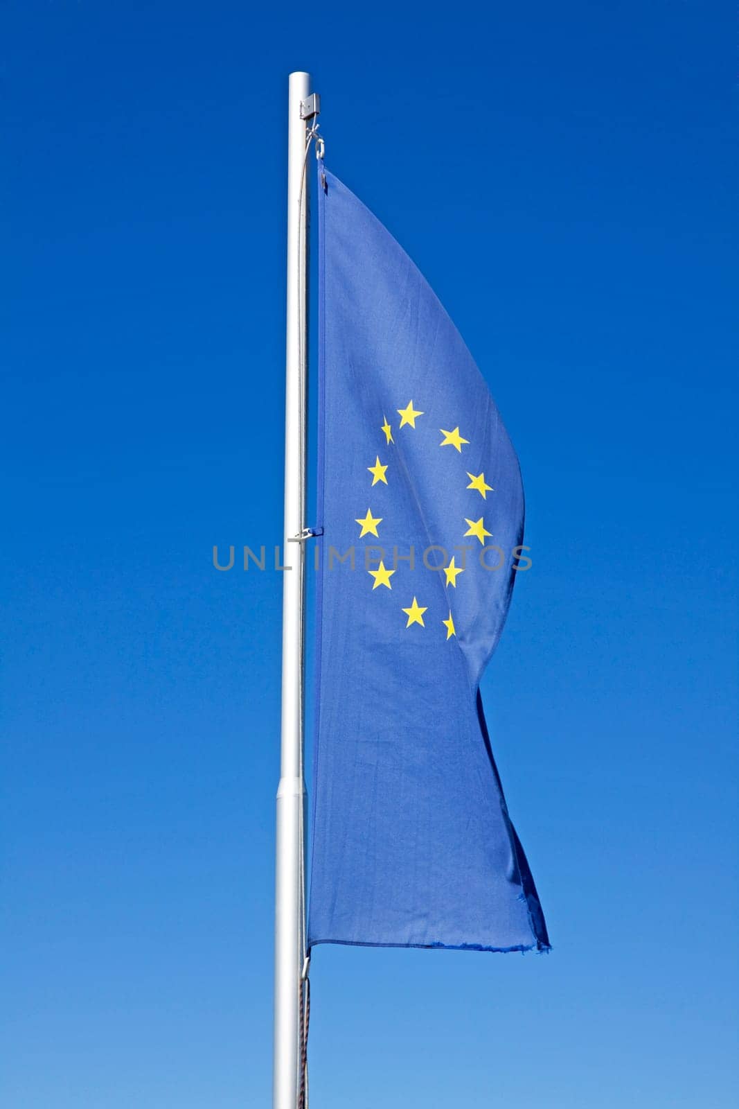 european flag waving on a pole