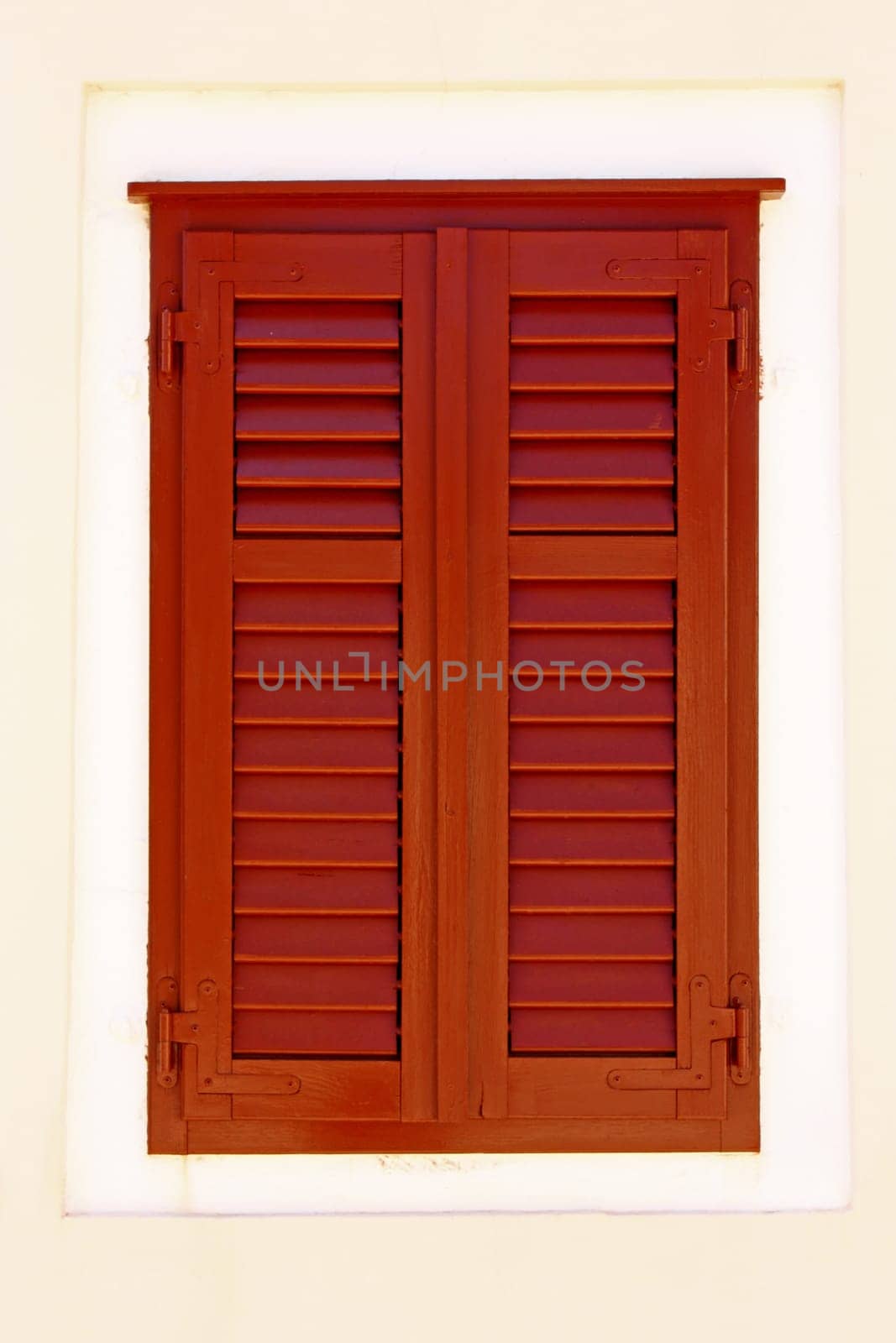 closed brown wooden window shutters, security element