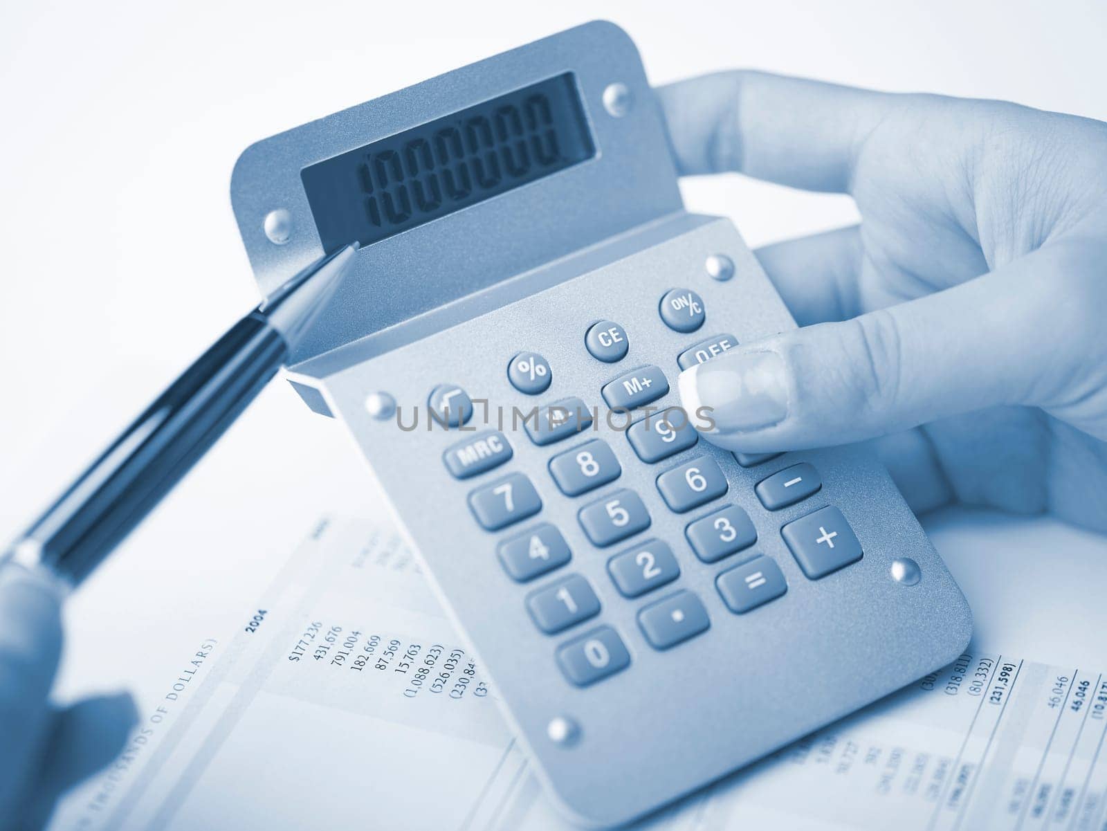 Market Analyze - pen and calculator on papers
