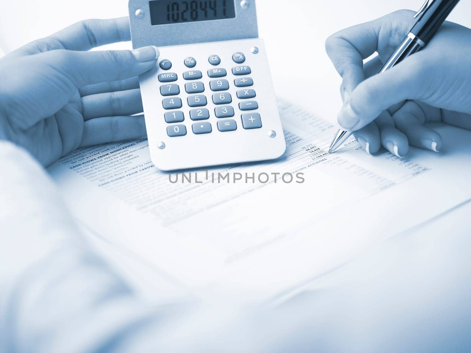 Market Analyze - pen and calculator on papers