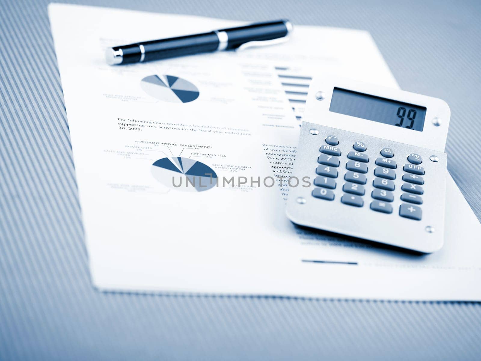Market Analyze - pen and calculator on papers