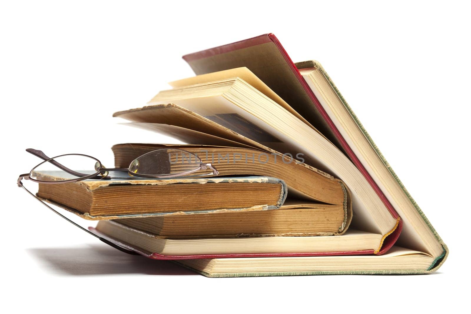 Group of Old Antique Books and eyeglasses isolated on white