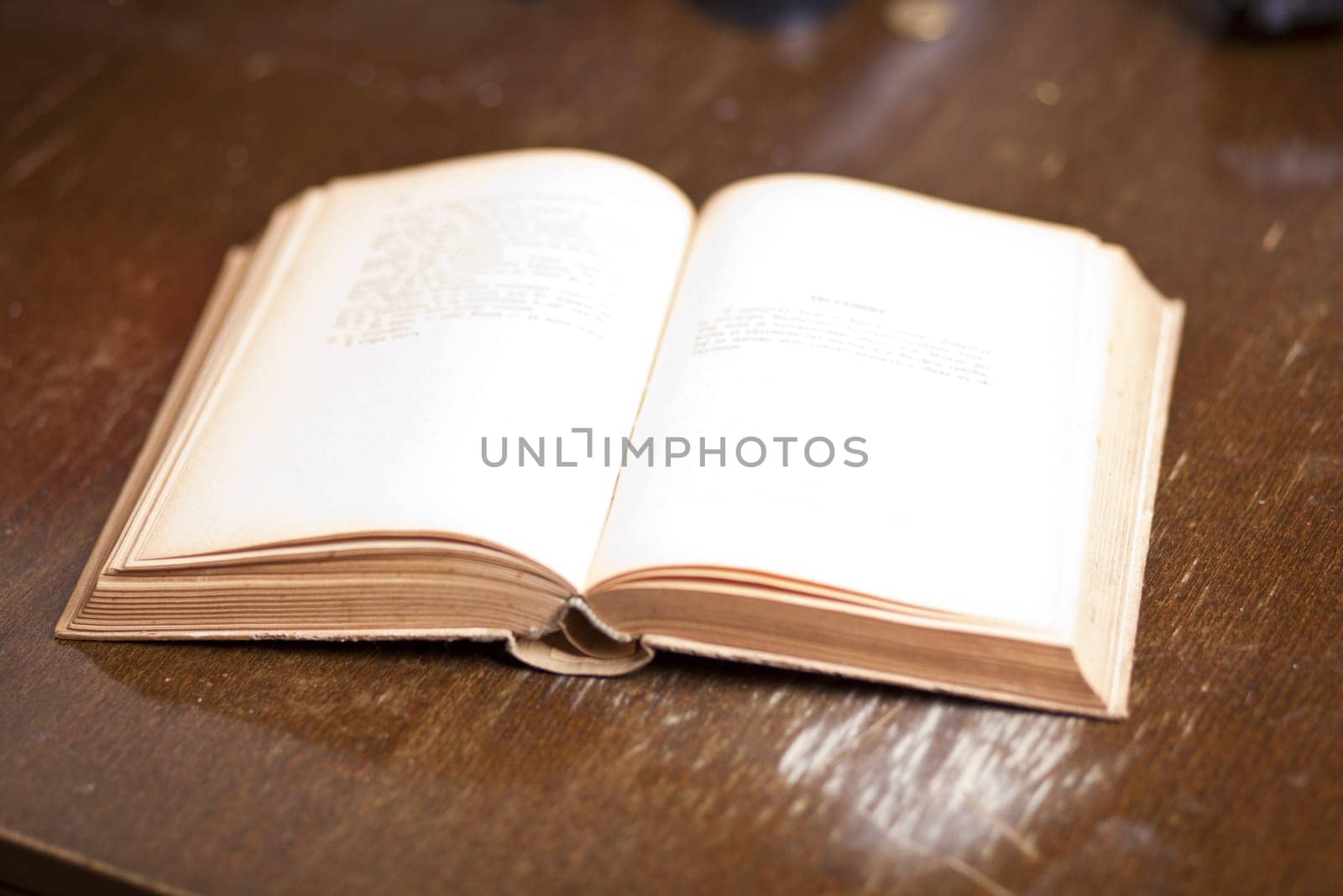 Open Old Antique Book on wooden table