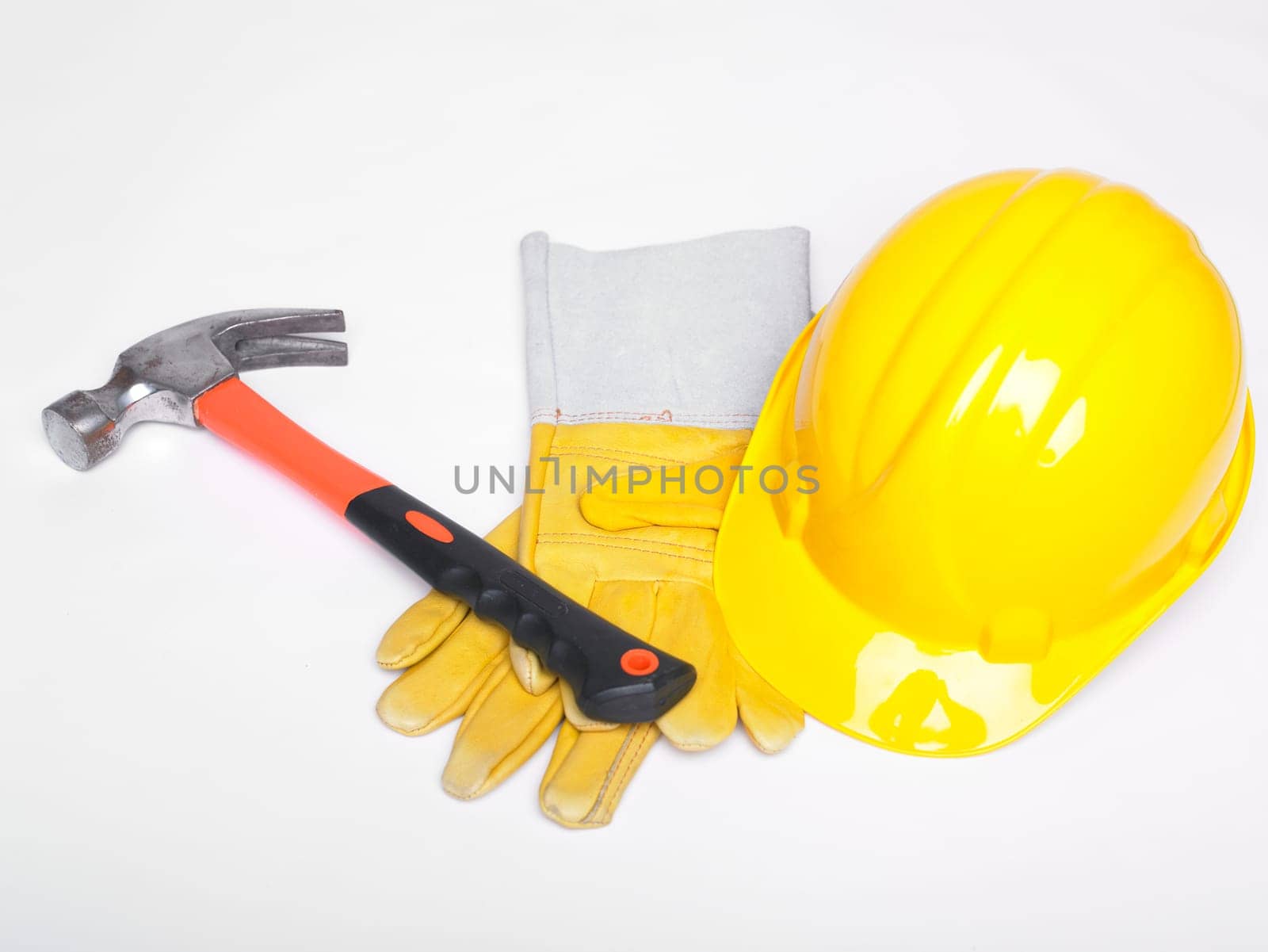 Hammer Hard Hat And Leather Gloves on white