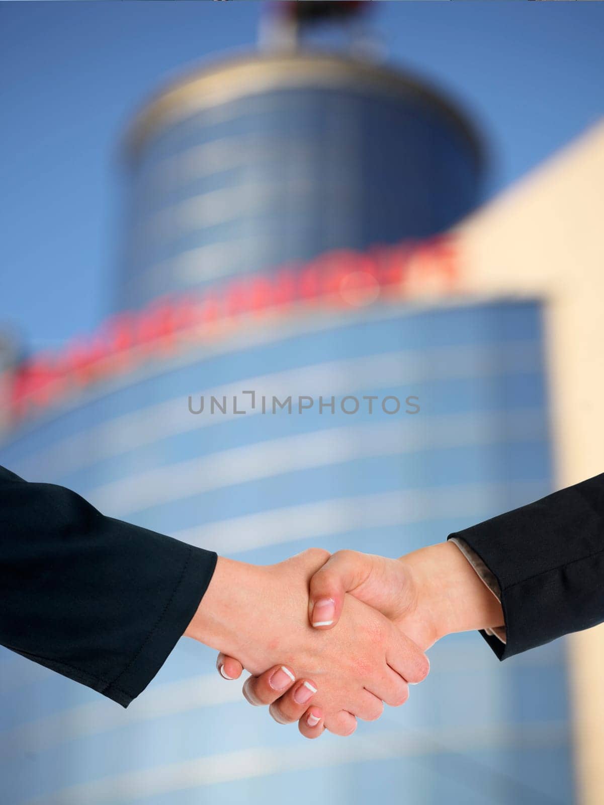Handshake Handshaking and blured building in background
