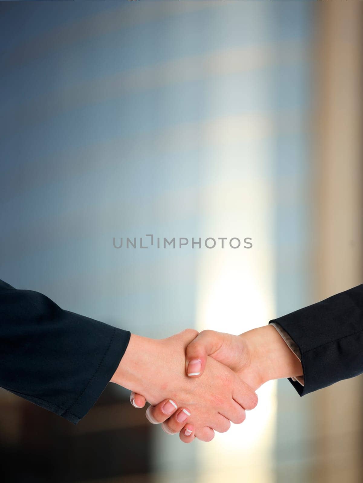 Handshake Handshaking and blured building in background