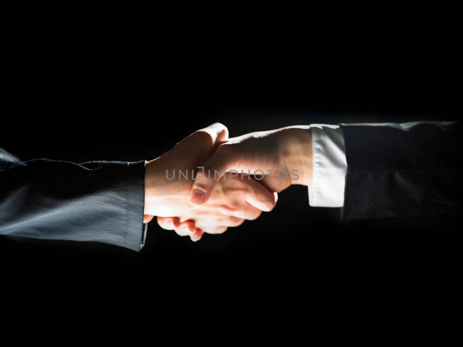 Handshake Handshaking light and dark