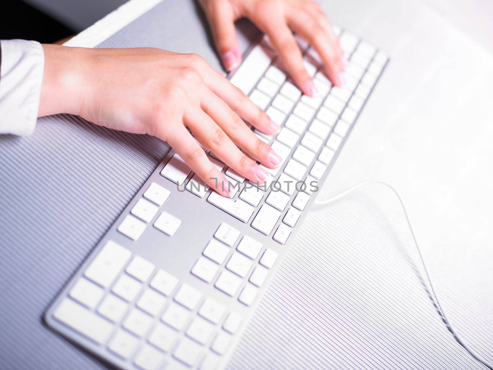 Business Secretary Typing on Computer Keyboard