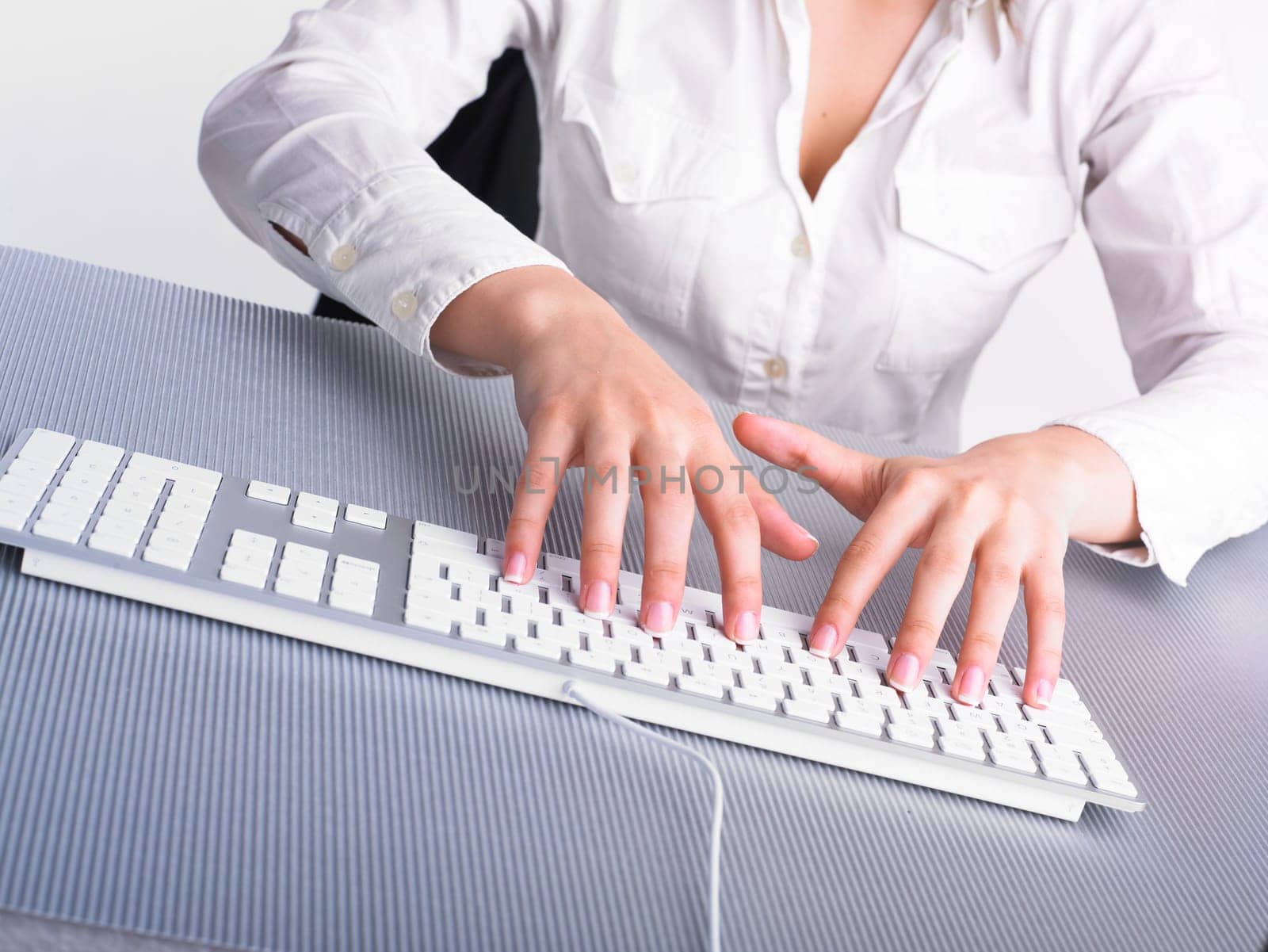 Business Secretary Typing on Computer Keyboard
