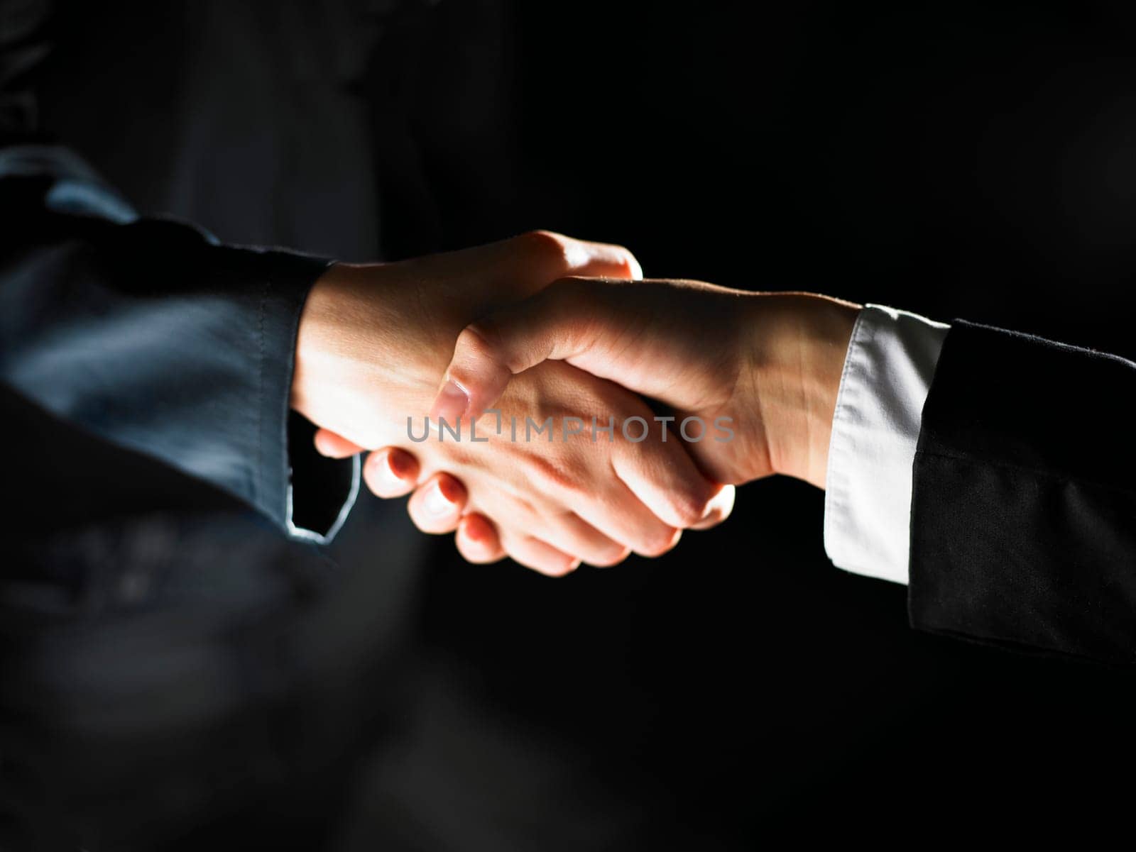 Handshake Handshaking dark and light