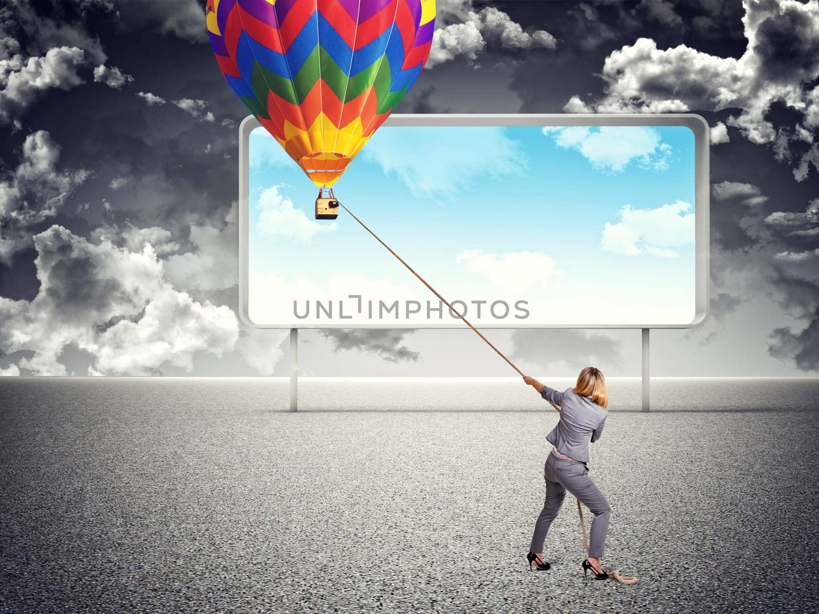 businesswoman pull hot air balloon