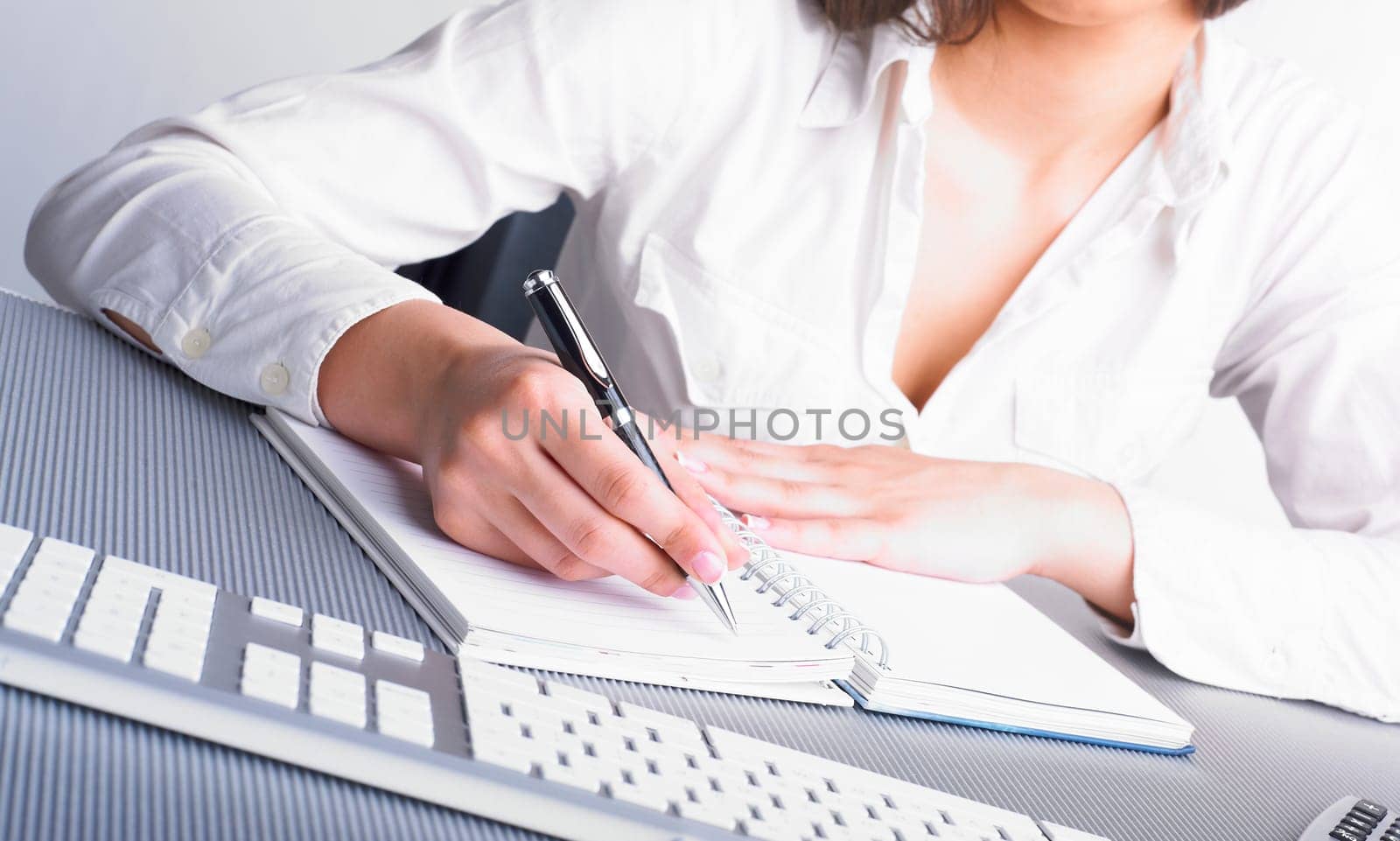 Office Assistant in white writing Schedule