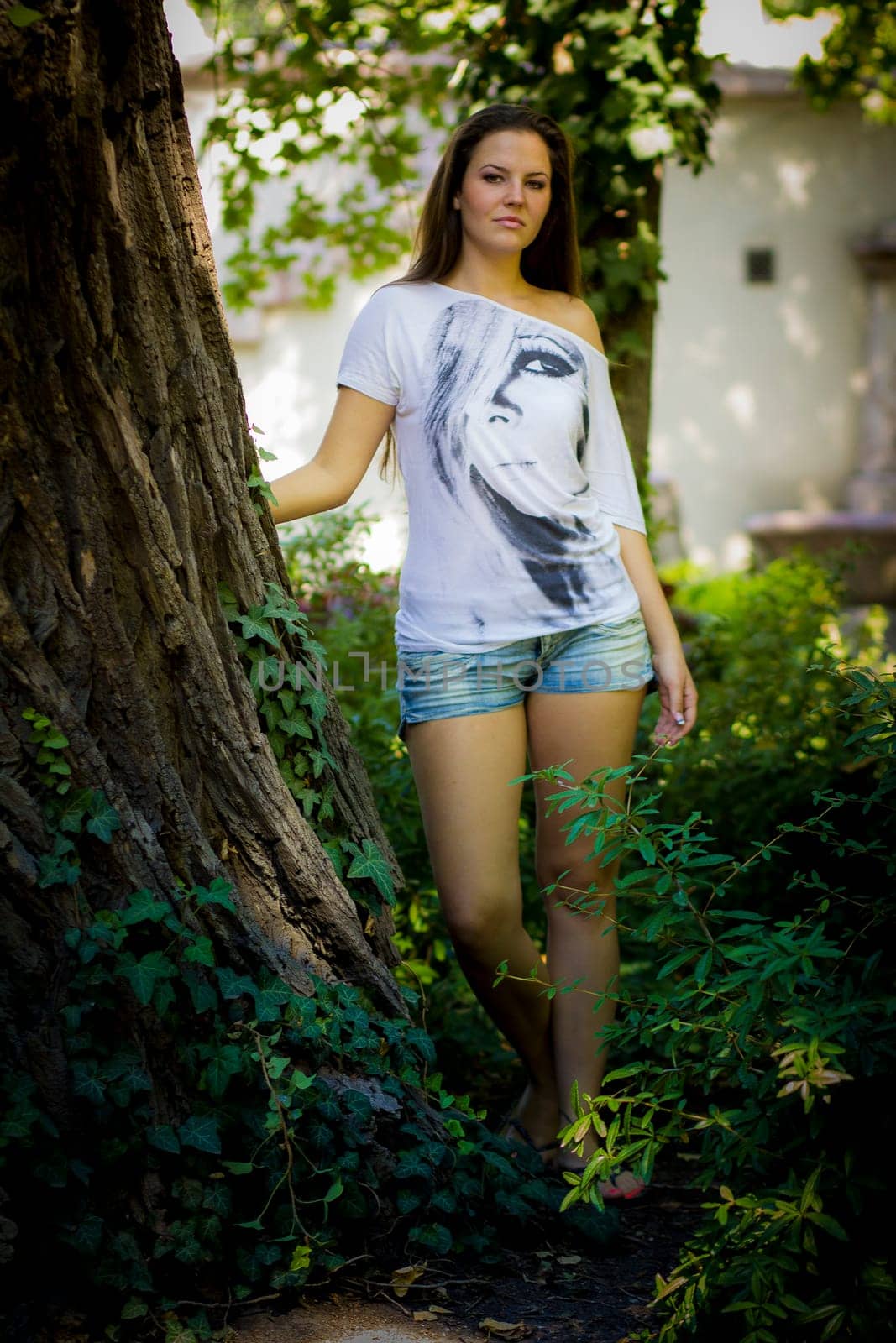 Young woman in the forest on a sunny day