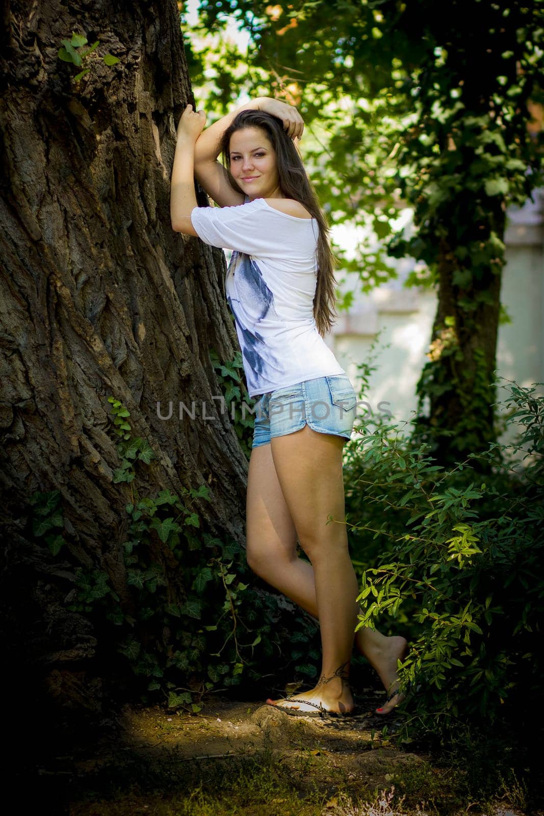 Young woman in the forest on a sunny day