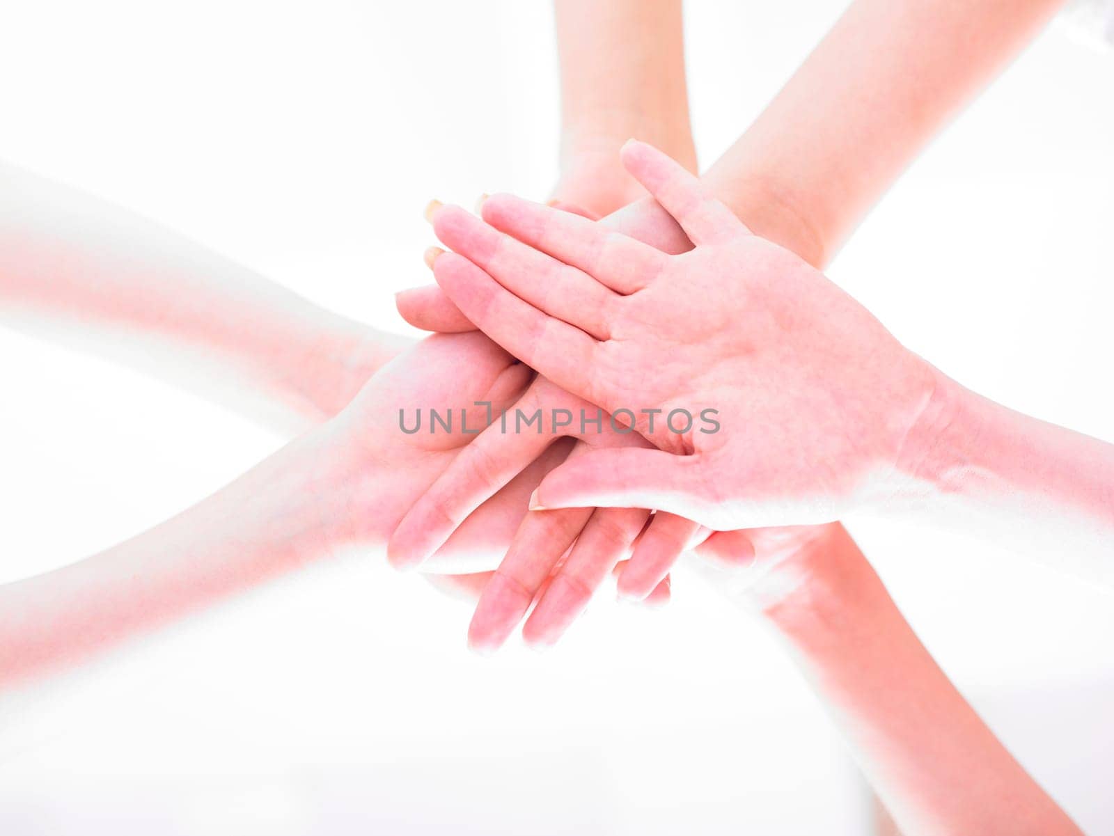 Business team join hands on white background
