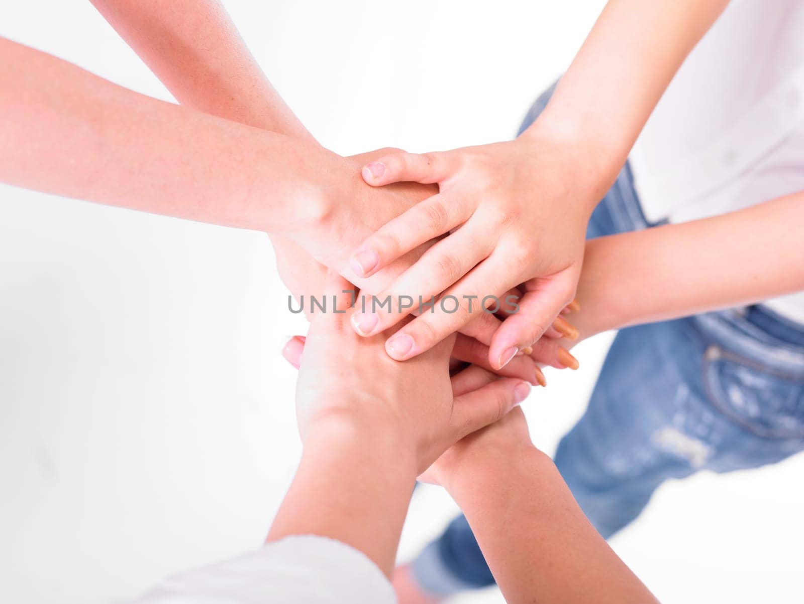 Business team join hands on white background