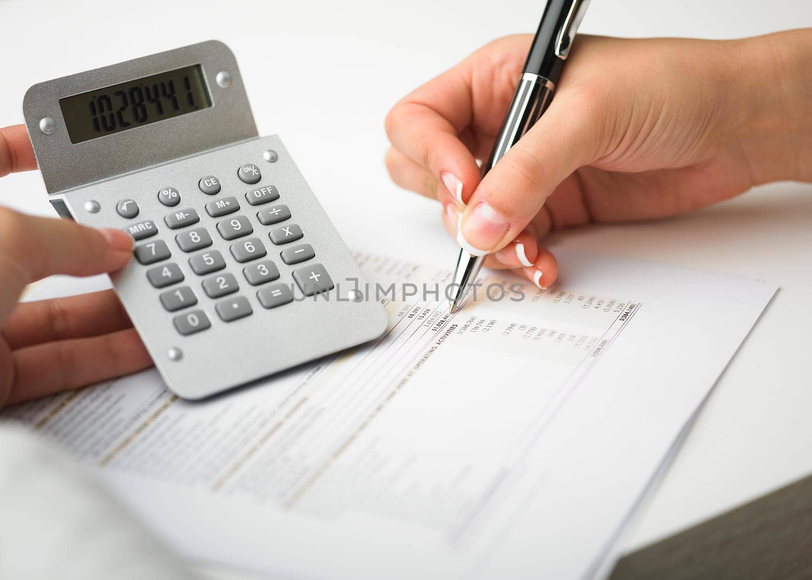Market Analyze - pen and calculator on papers