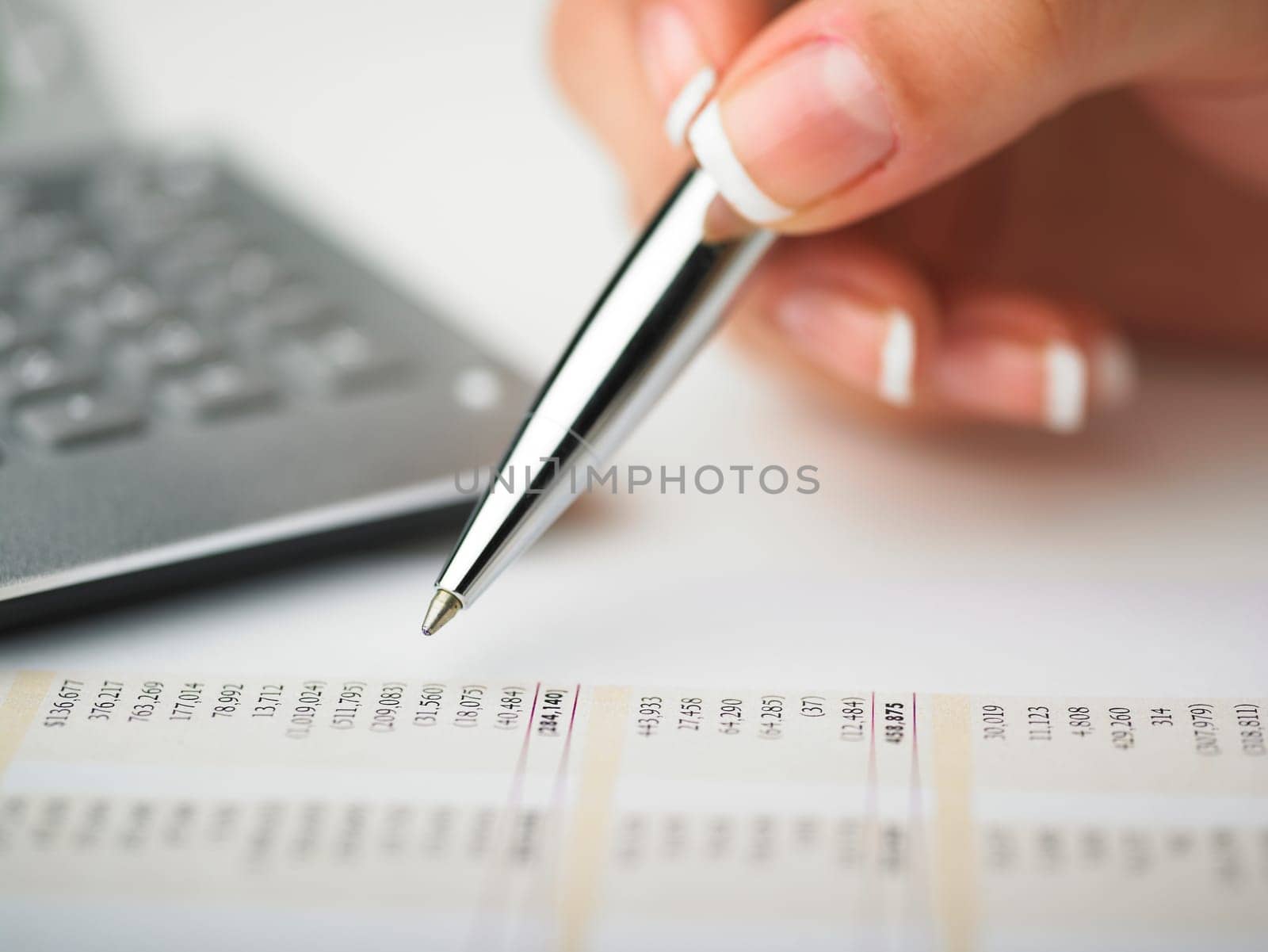 Market Analyze - pen and calculator on papers