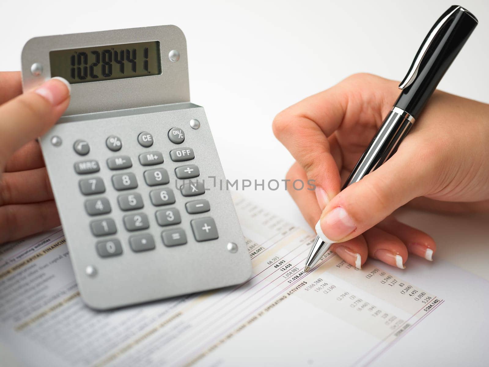 Market Analyze - pen and calculator on papers