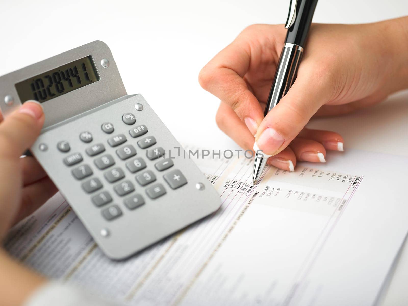 Market Analyze - pen and calculator on papers