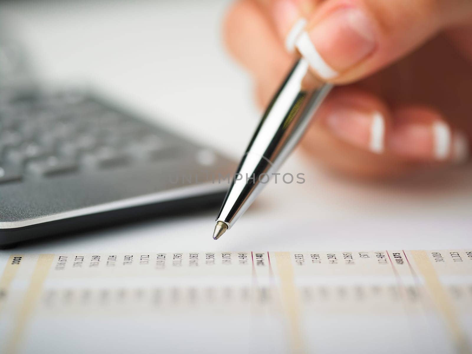 Market Analyze - pen and calculator on papers