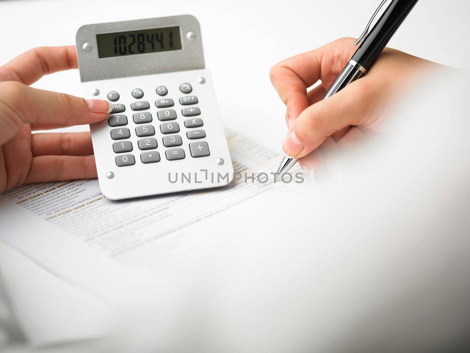 Market Analyze - pen and calculator on papers