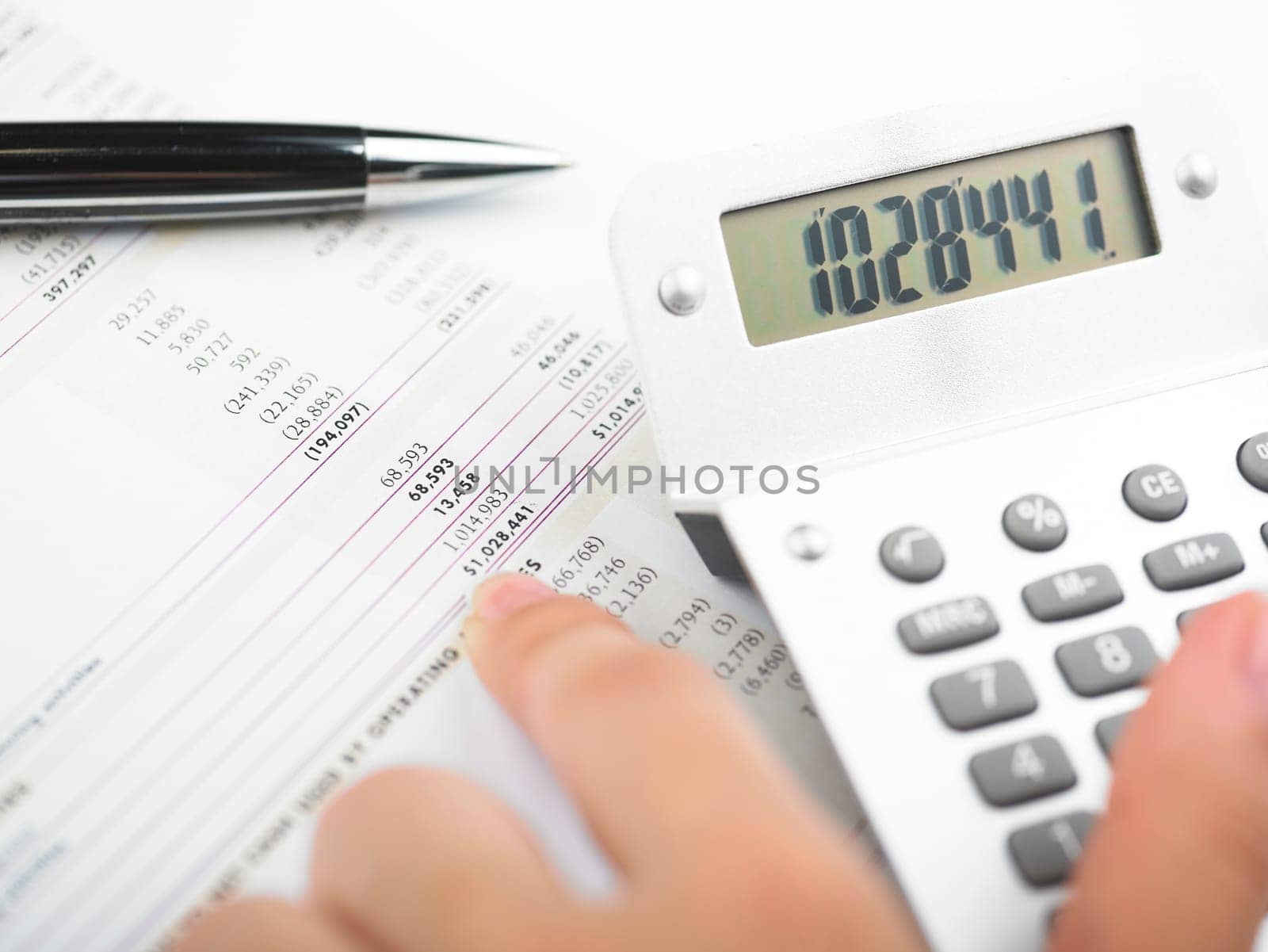 Market Analyze - pen and calculator on papers