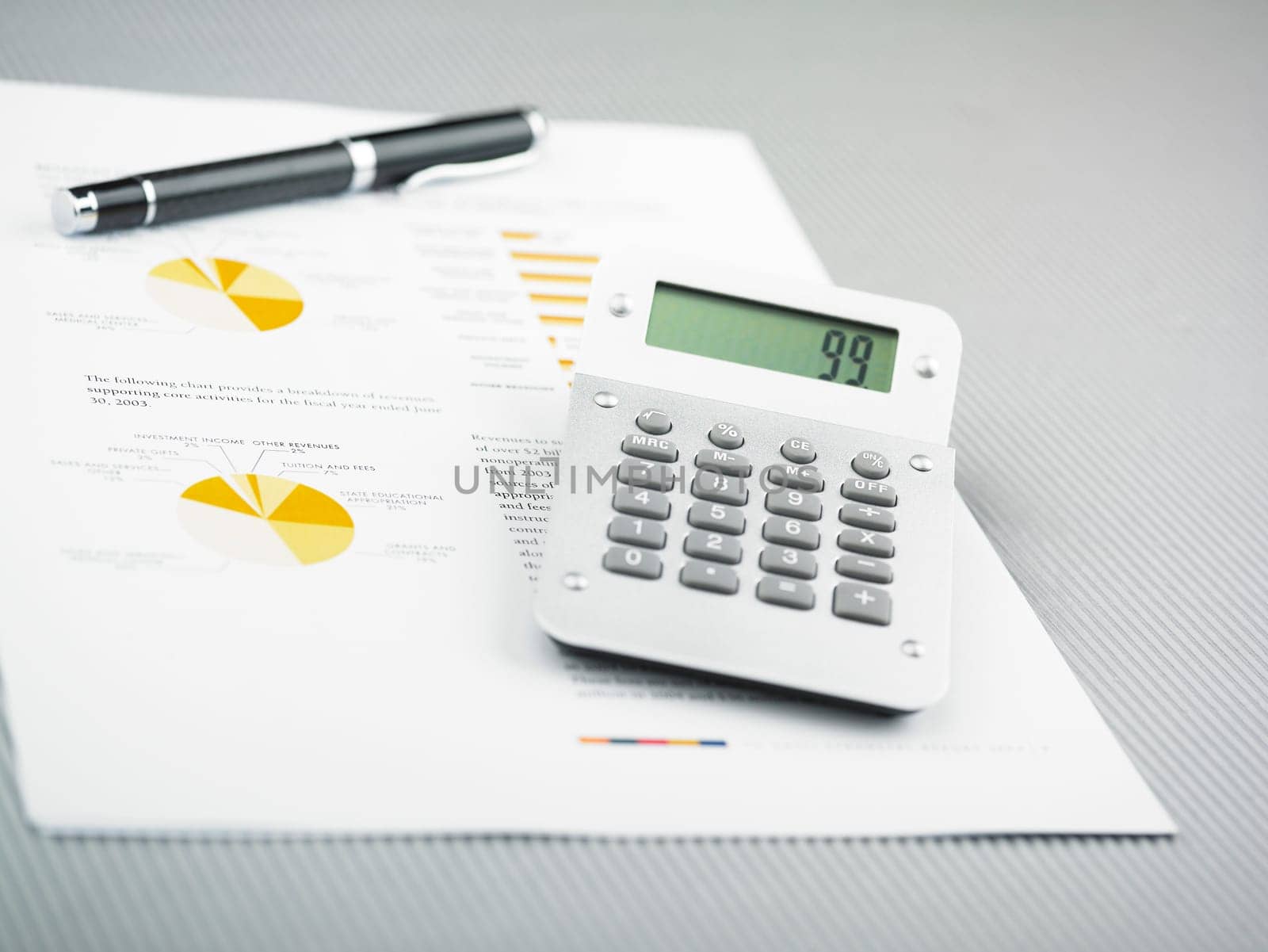 Market Analyze - pen and calculator on papers