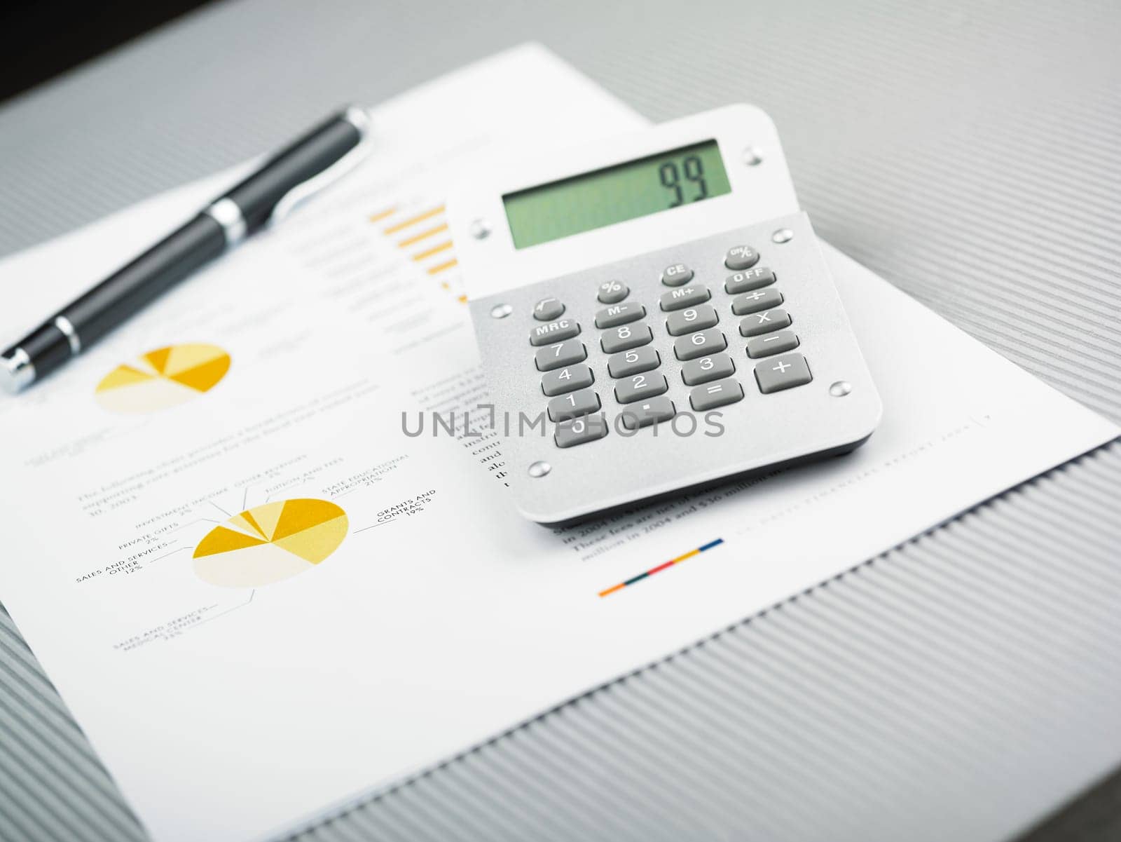 Market Analyze - pen and calculator on papers