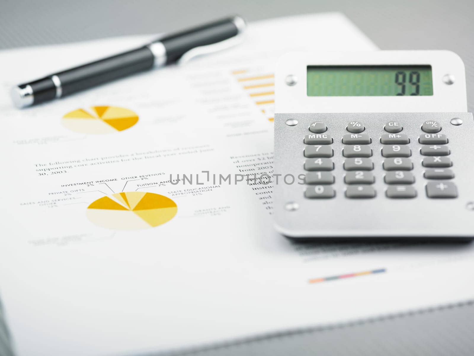 Market Analyze - pen and calculator on papers