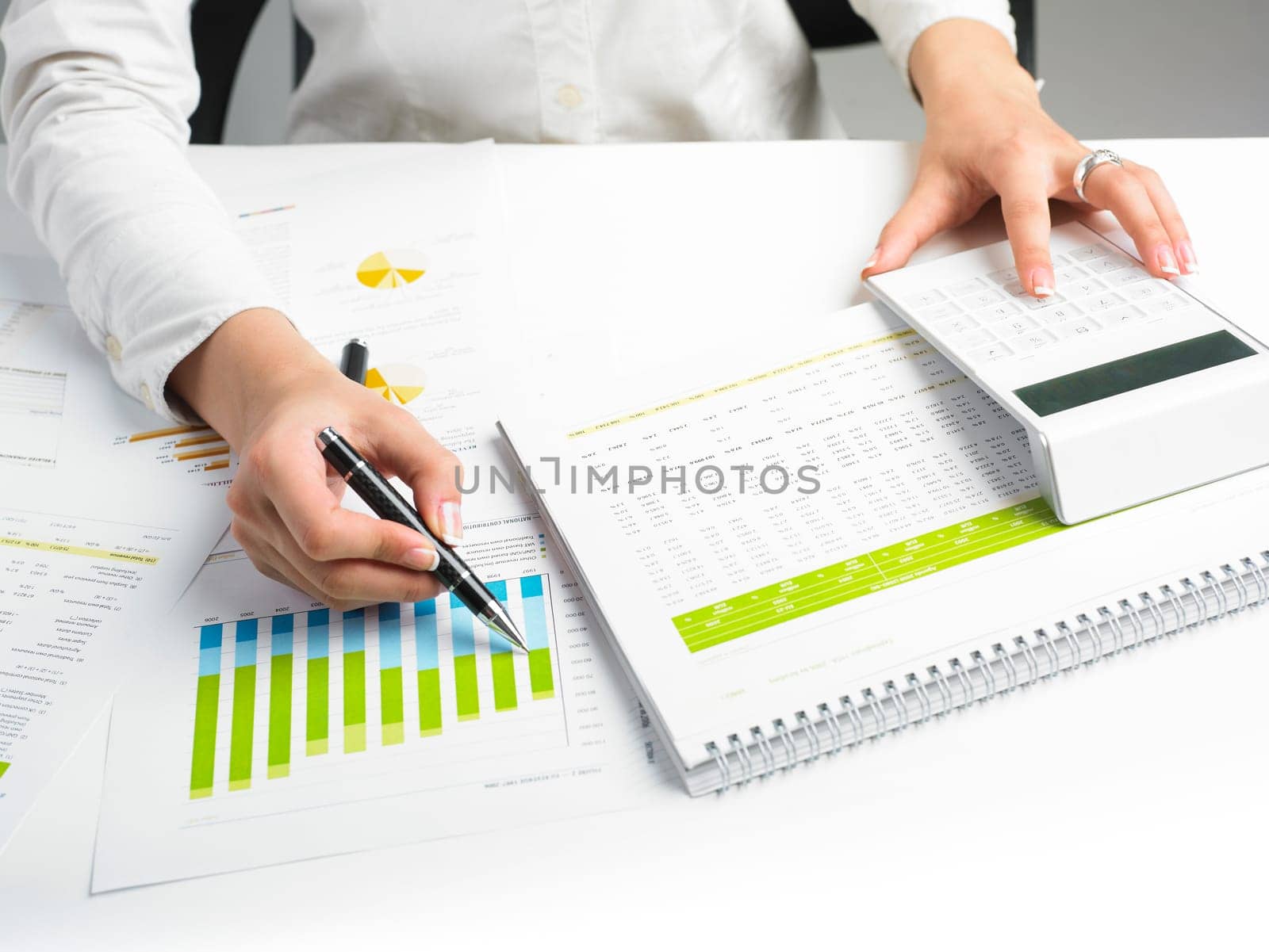 Market Analyze - pen and calculator on papers