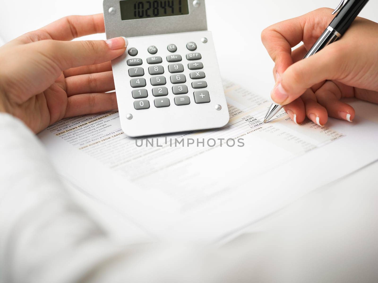 Market Analyze - pen and calculator on papers
