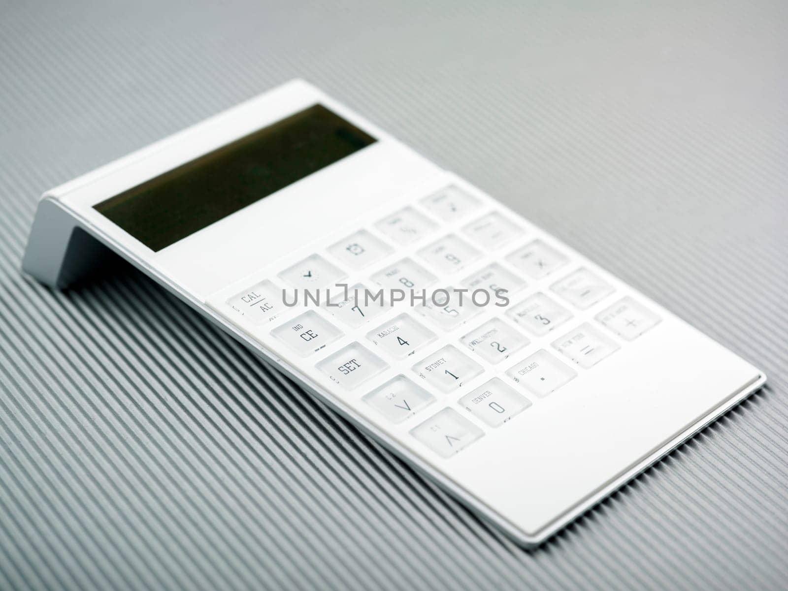 White Calculator On Office Desk
