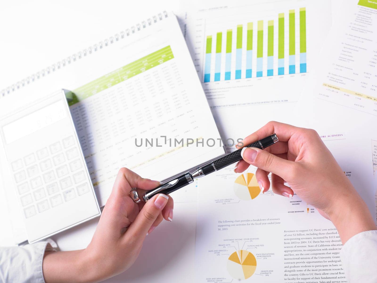 Analyzing Business Data - pen and numbers on paper