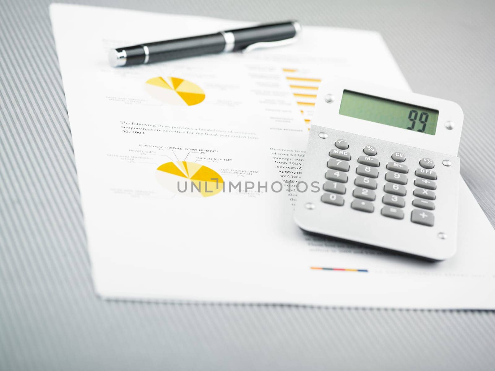 Market Analyze - pen and calculator on papers