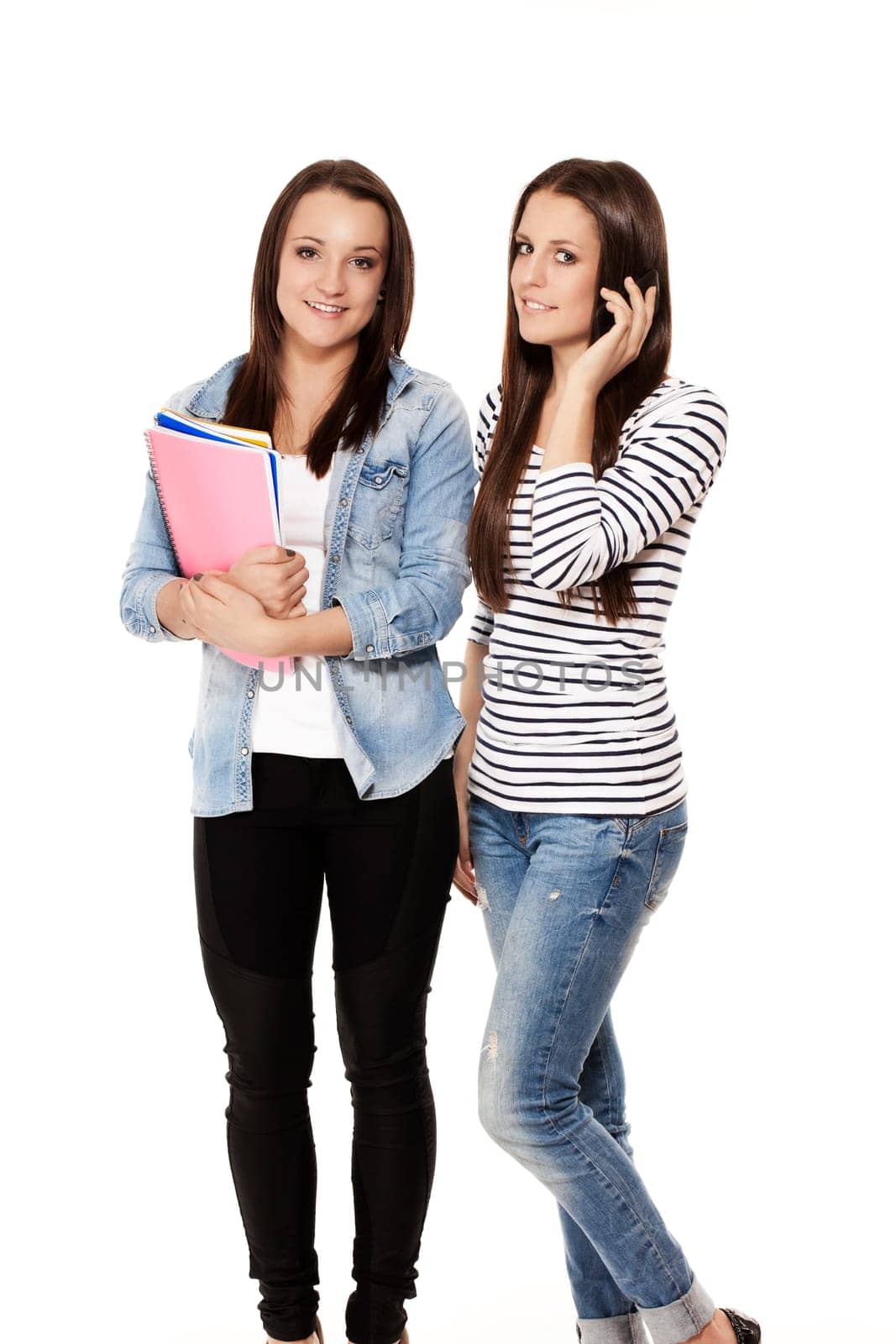 Teenager talking on the phone against white background
