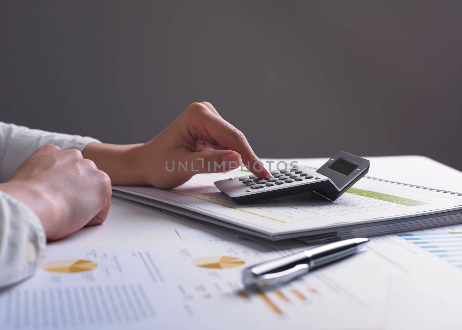 Analyzing Business Data - pen and numbers on paper
