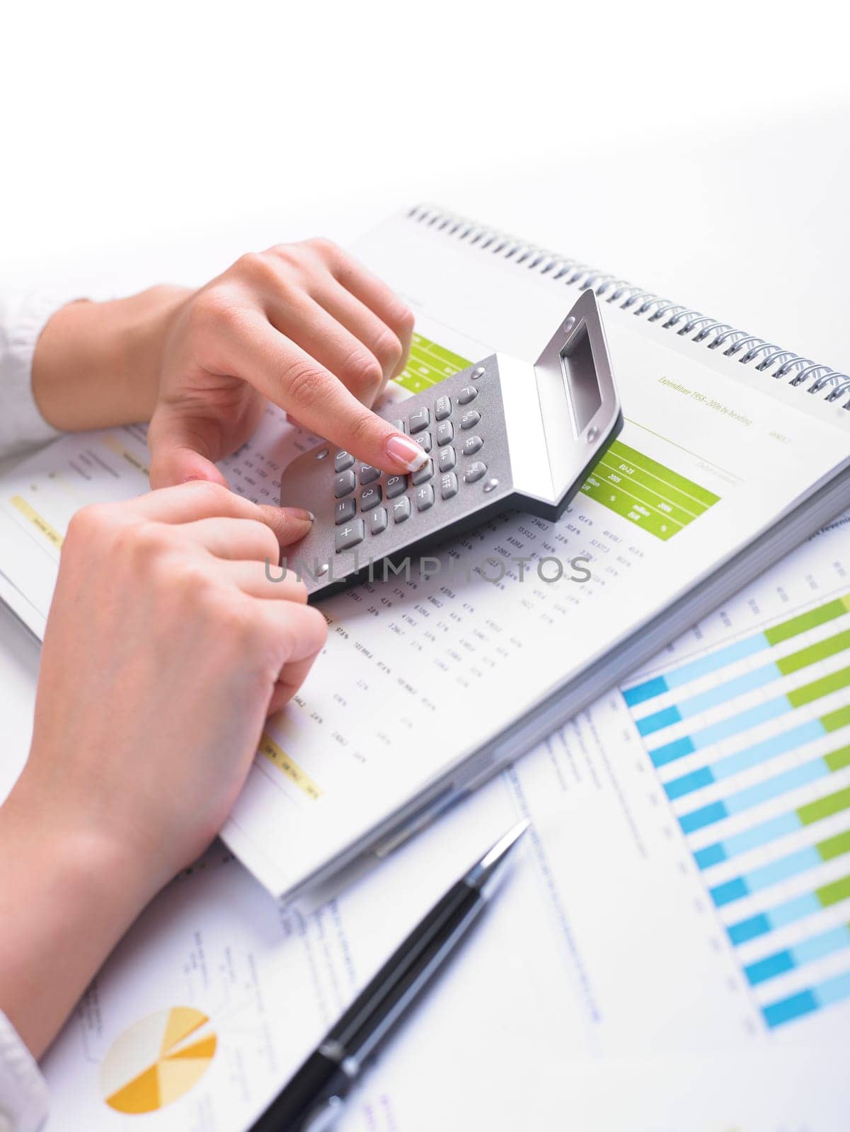 Analyzing Business Data - pen and numbers on paper