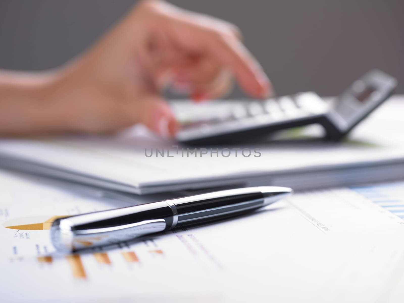 Market Analyze - pen and calculator on papers