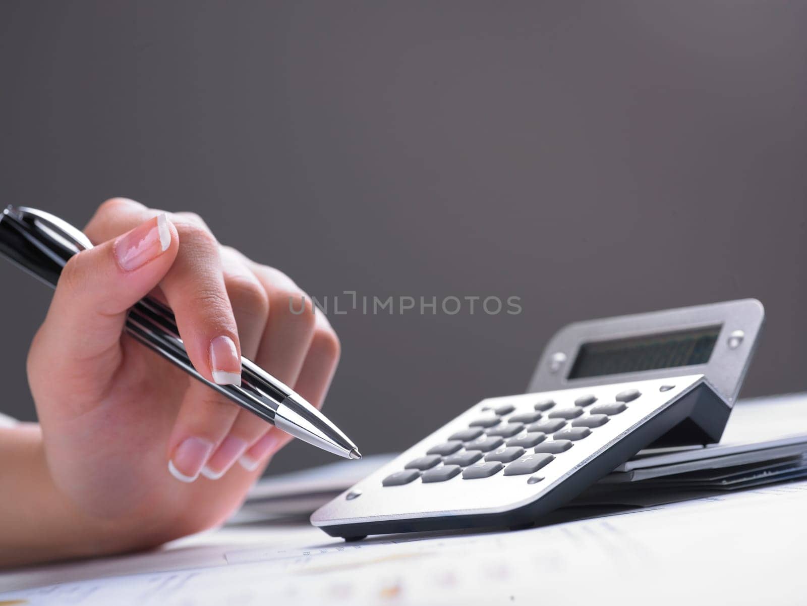 Market Analyze - pen and calculator on papers