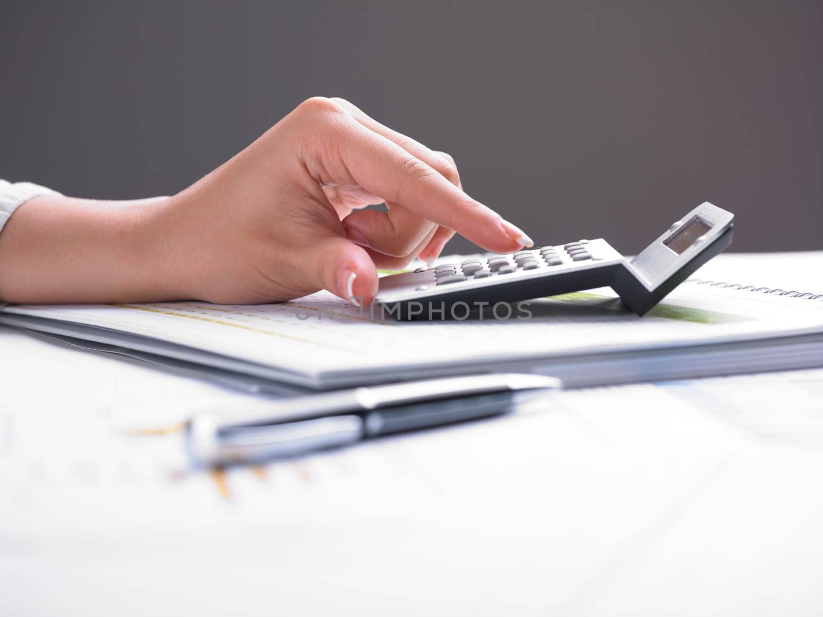 Market Analyze - pen and calculator on papers