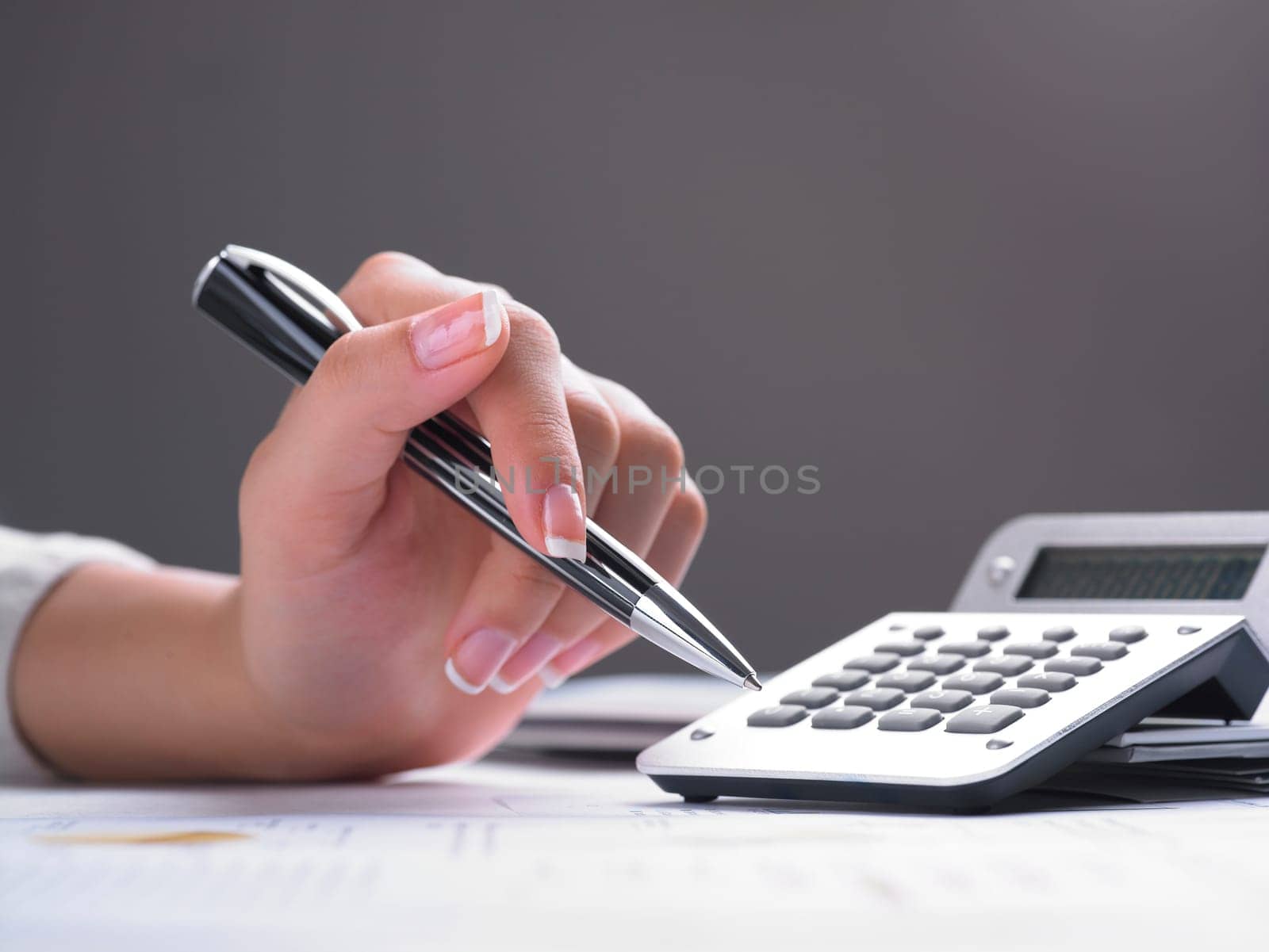 Market Analyze - pen and calculator on papers