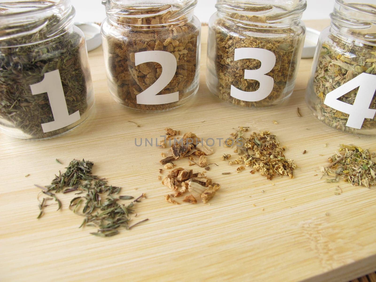 Medicinal herb samples with thyme,gentian root,elderflower,primrose blossom