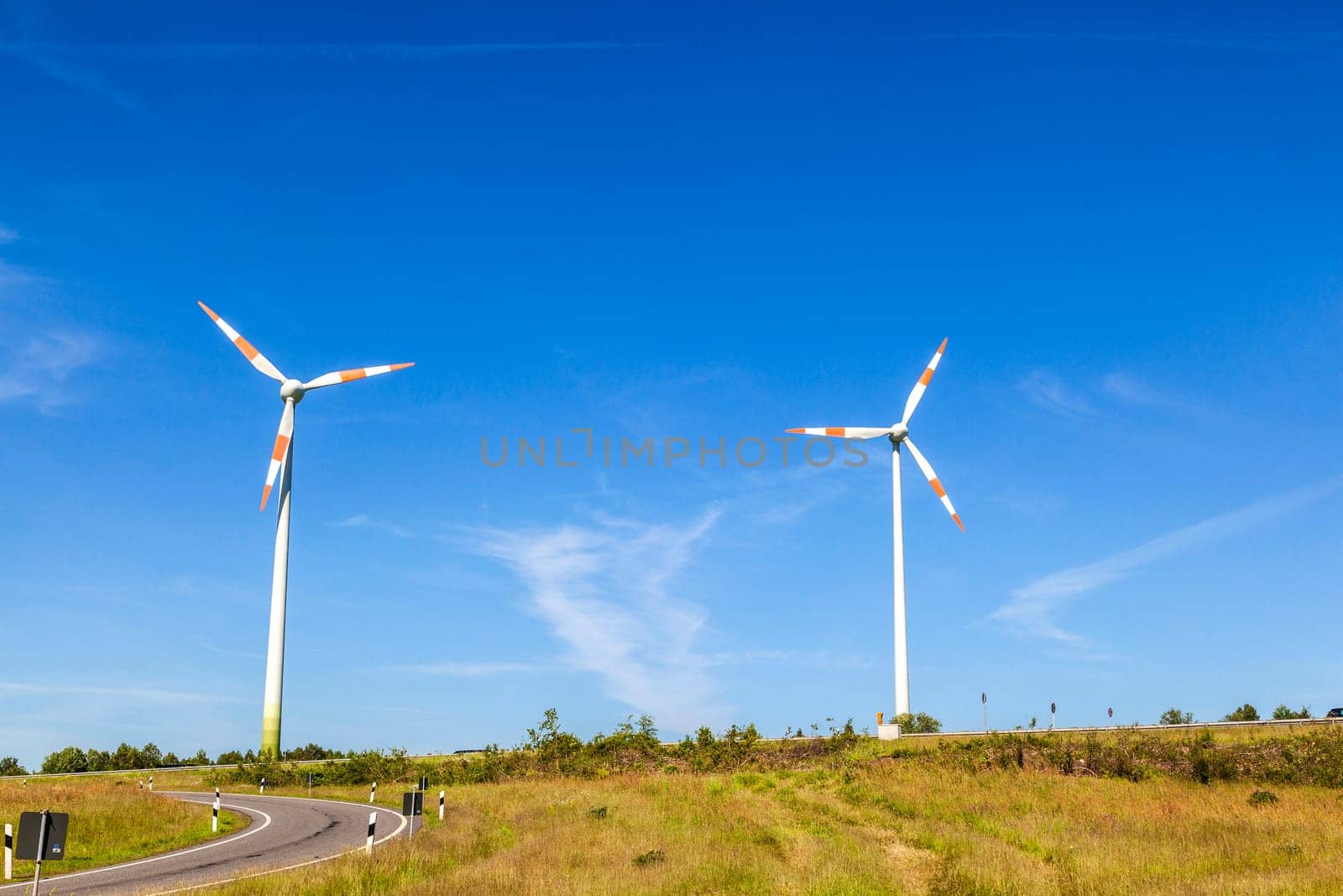 Windmill gathers energy from the summer breeze.