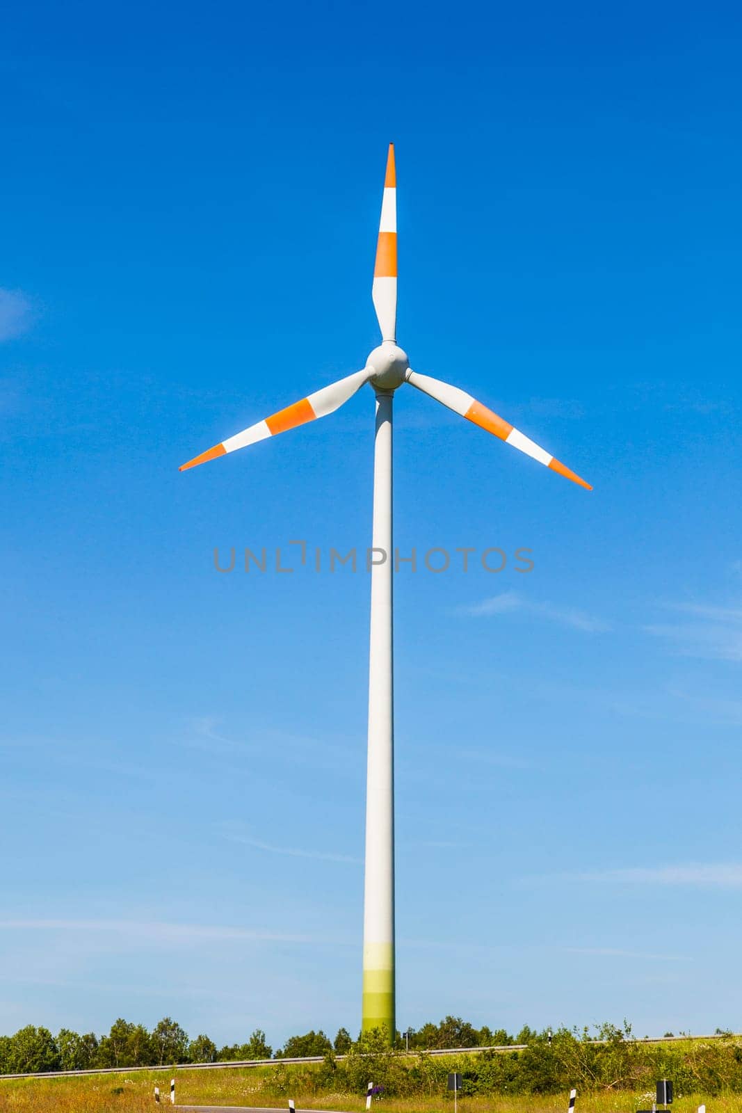 Windmill gathers energy from the summer breeze.