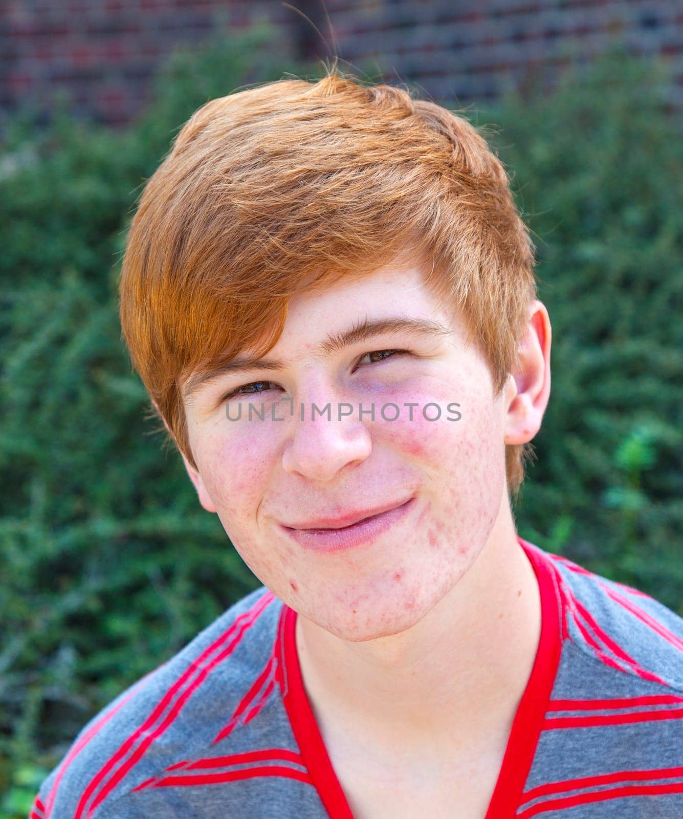 smart boy sitting on a bench