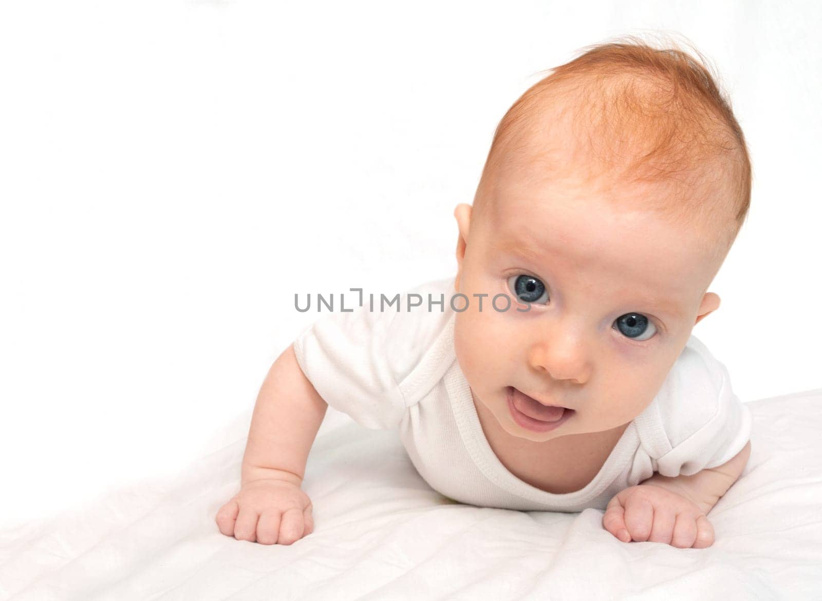 Newborn Baby Lying on Front on White Background