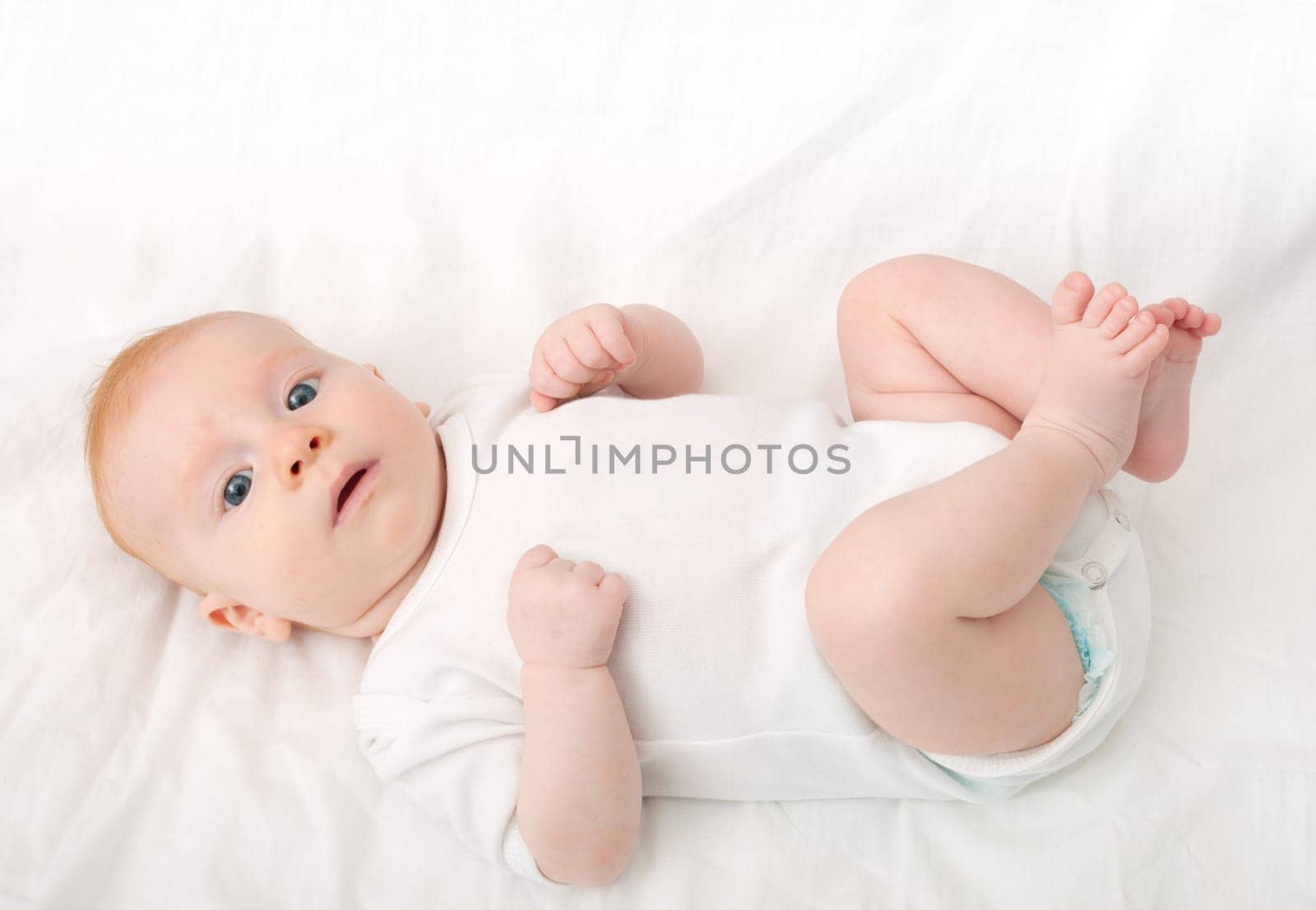 Newborn Baby Lying on Back on White Background